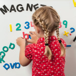 Girl playing with Foam Fun letters and numbers