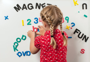 Girl playing with Foam Fun letters and numbers
