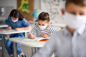 shutterstock_1751409812 students with masks small 72